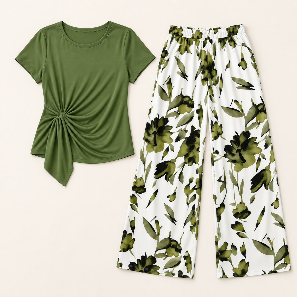 Flat lay of olive green top and white floral wide-leg pants